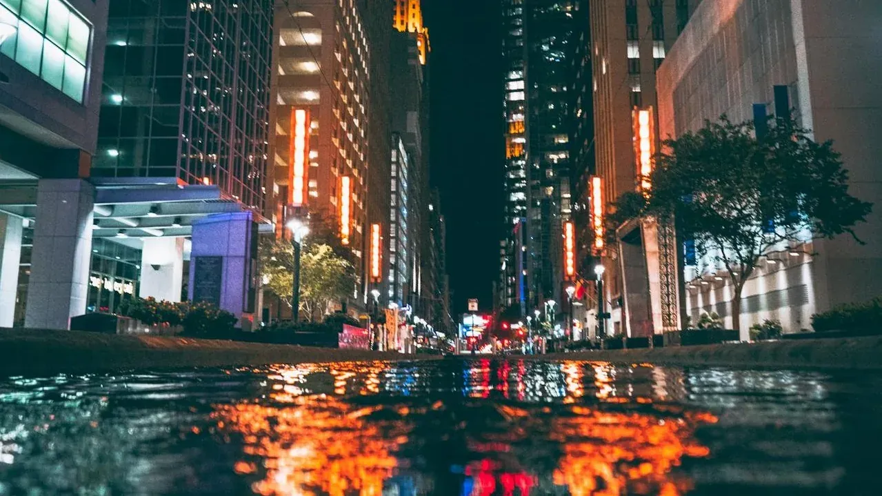 City street at night with reflections
