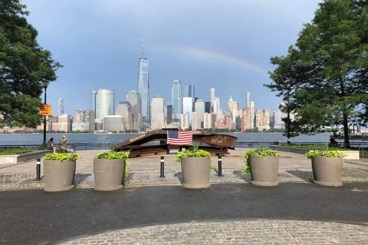 NYC skyline with rainbow from memorial park