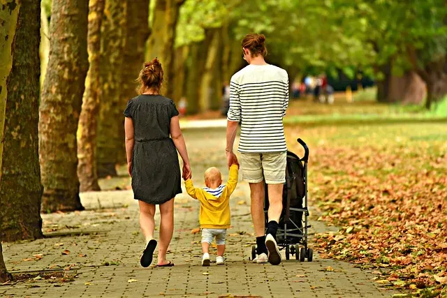Parents and children walking together in a leafy New Jersey neighborhood
