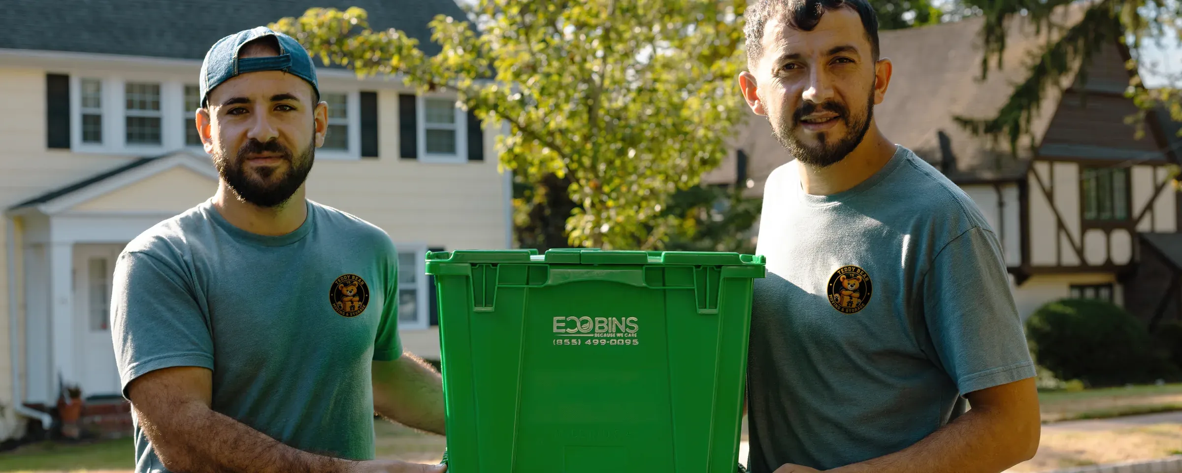 Two Teddy Bear Moving crew members outside a New Jersey home, ready to start the job
