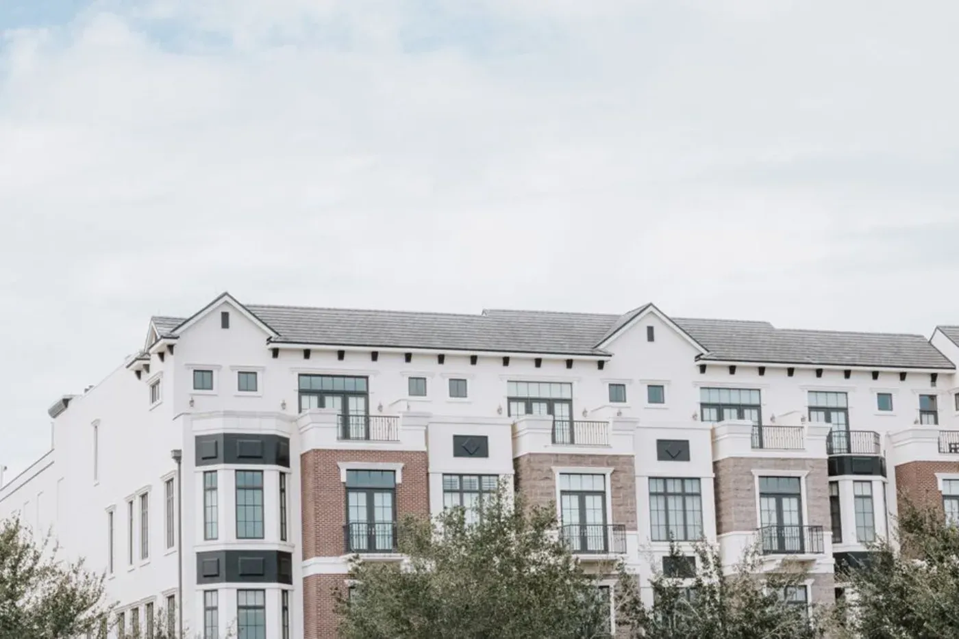 An apartment community with balconies and shared entrances