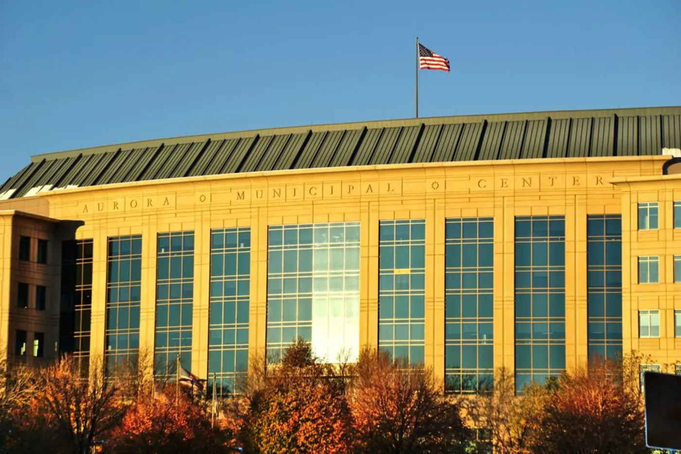 A municipal government building flying the American flag