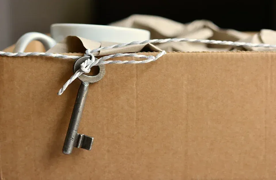 Movers loading labeled boxes into a truck in New Jersey