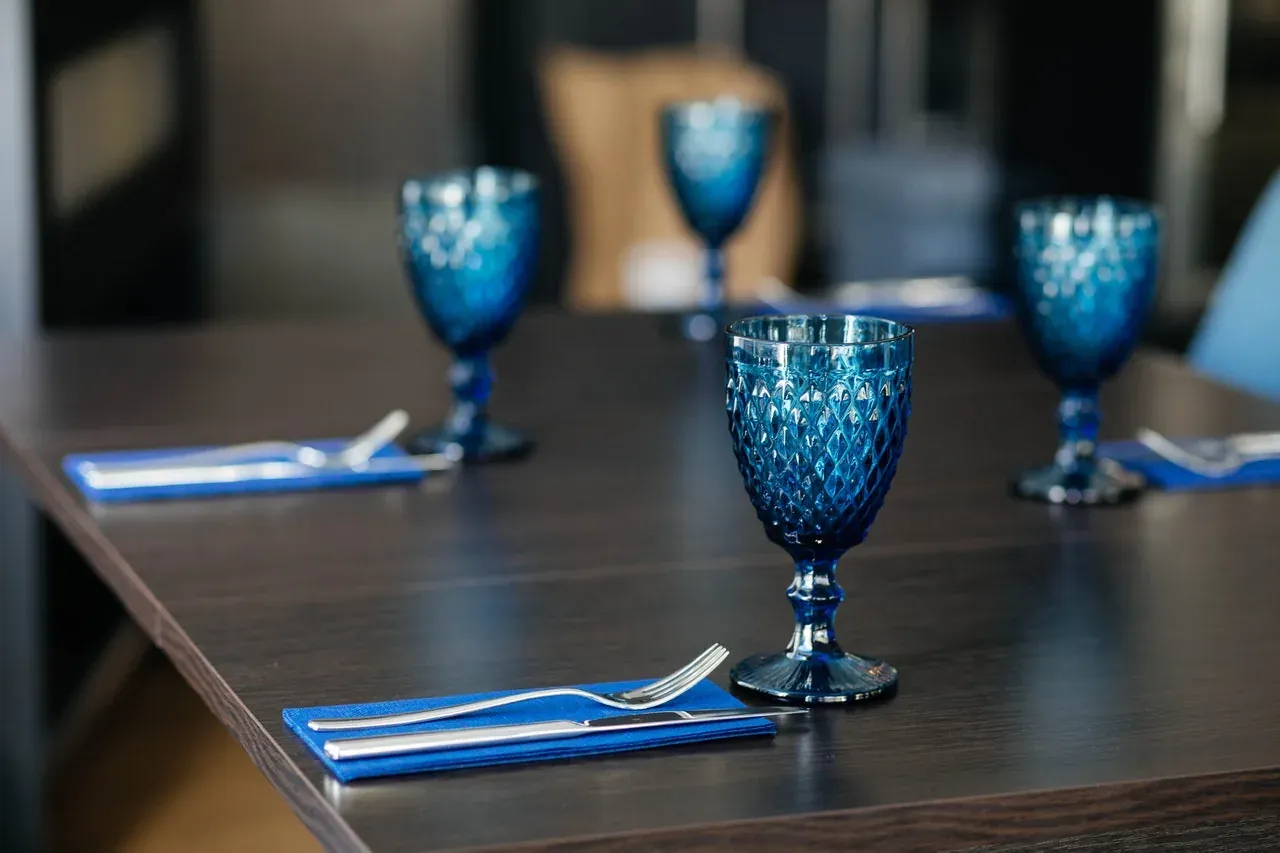 Wrapped glassware being packed into a moving box