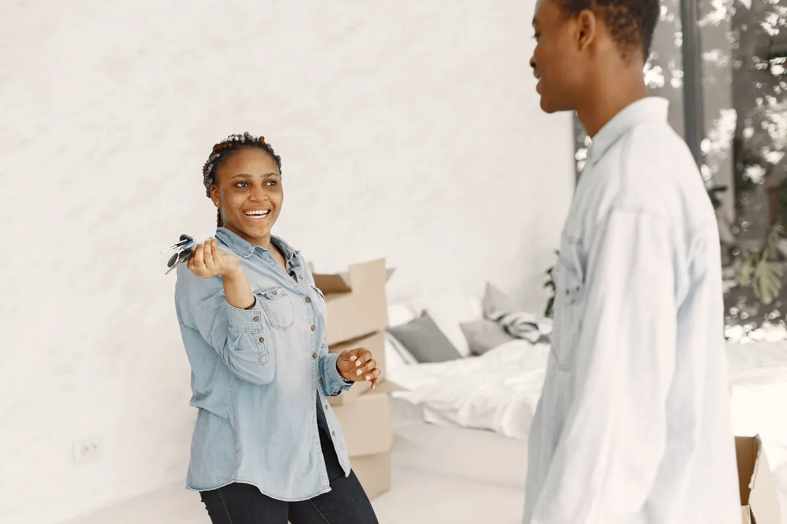 Movers carrying boxes into a New Jersey home