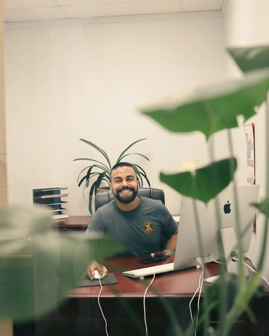 A Teddy Bear Moving coordinator at his desk in the New Jersey office