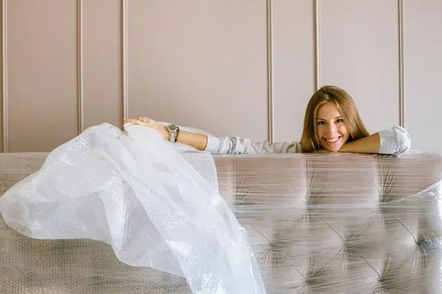 Movers carrying boxes into a New Jersey home