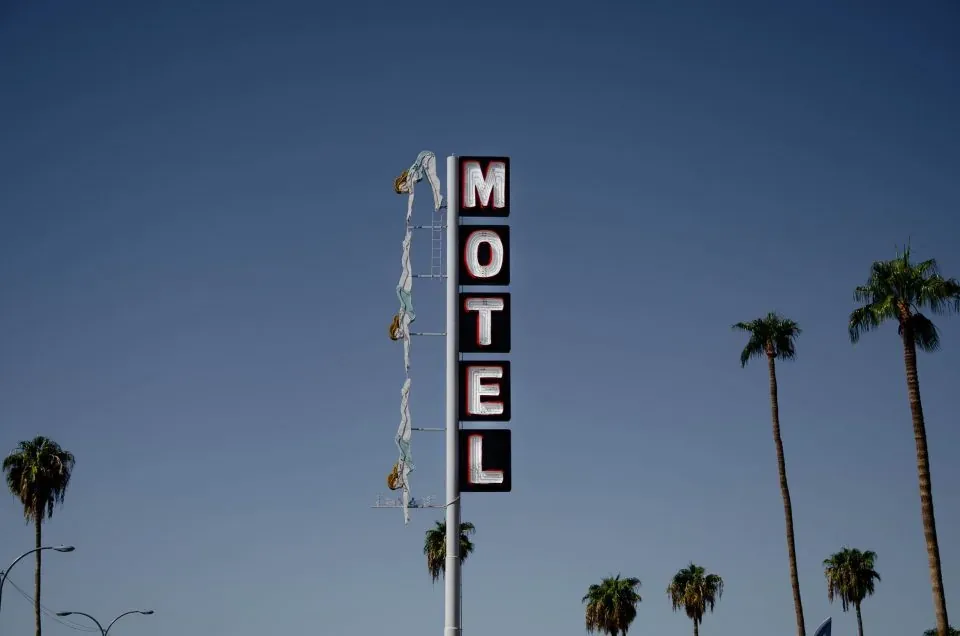 Vintage motel sign with palm trees