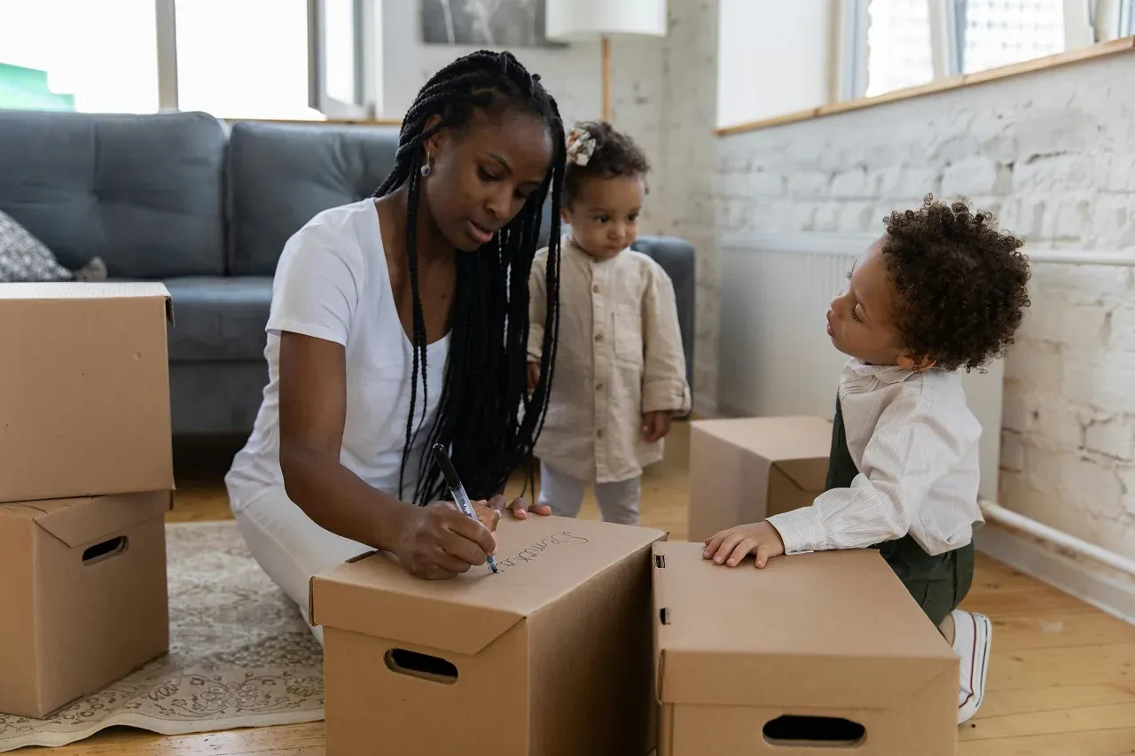 A family with young children unpacking boxes in a New Jersey home