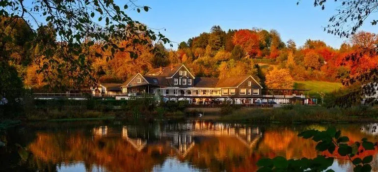 Lakeside house with autumn foliage