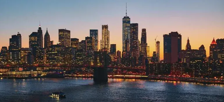 Manhattan skyline at dusk with bridge